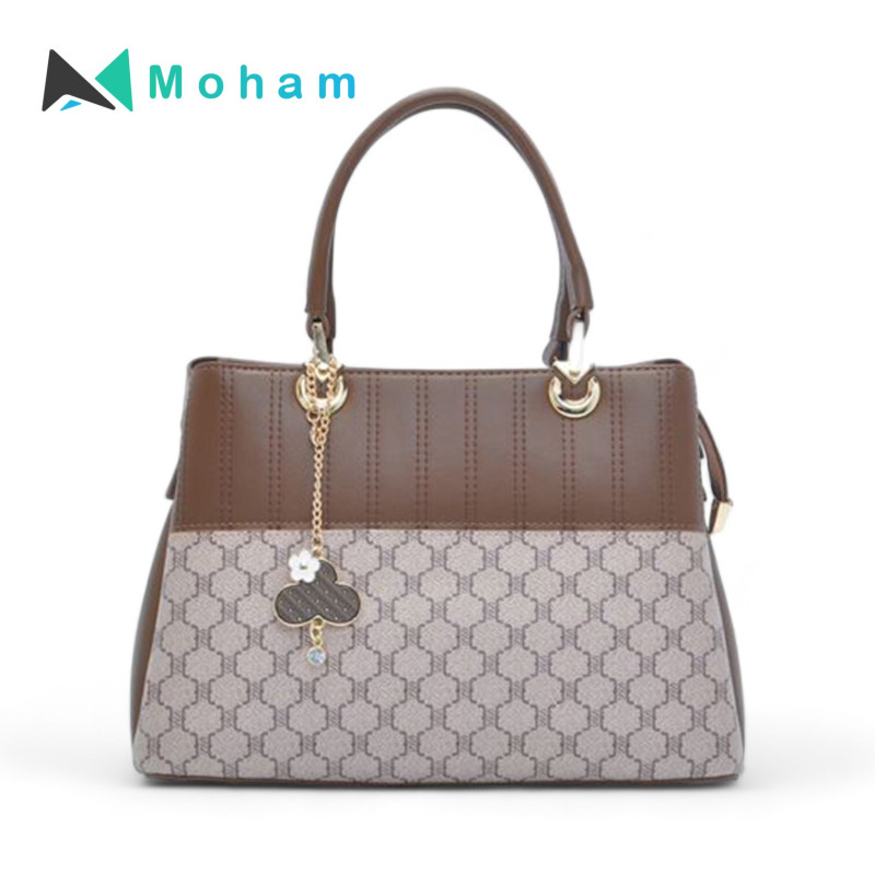 Stylish Two-Tone Handbag with Geometric Pattern and Charm Detail